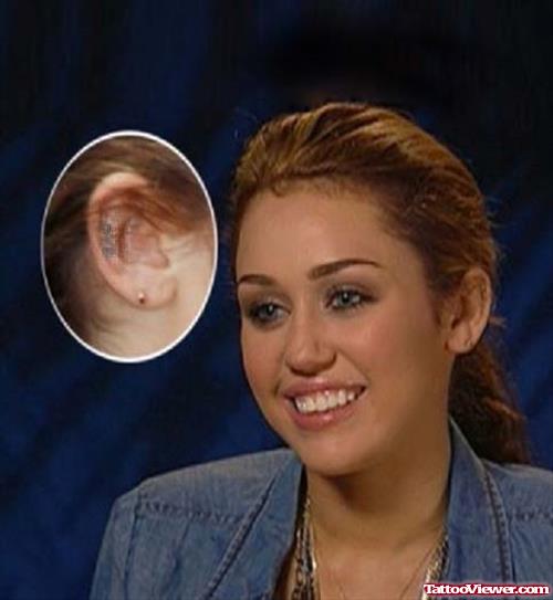 Miley Cyrus With Love Ear Tattoo