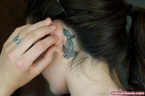 Girl Showing Her Fish Ear Tattoo