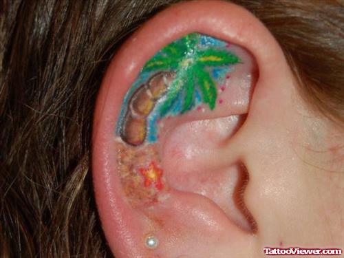 Color Palm Tree Tattoo In Right Ear