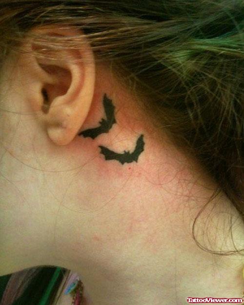Black Ink Flying Bats Ear Tattoo