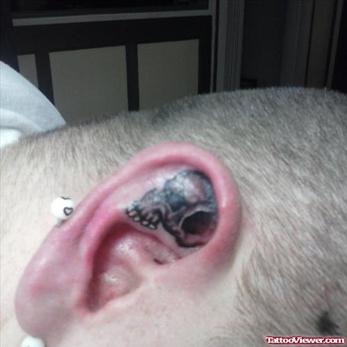 Grey Skull Ear Tattoo