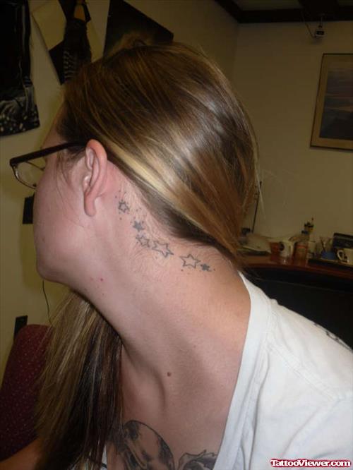 Girl Showing Stars Ear Tattoo
