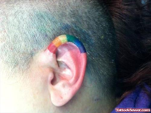 Colored Left Ear Tattoo
