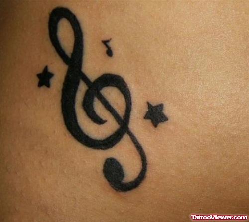 Black Star And Music Note Tattoo
