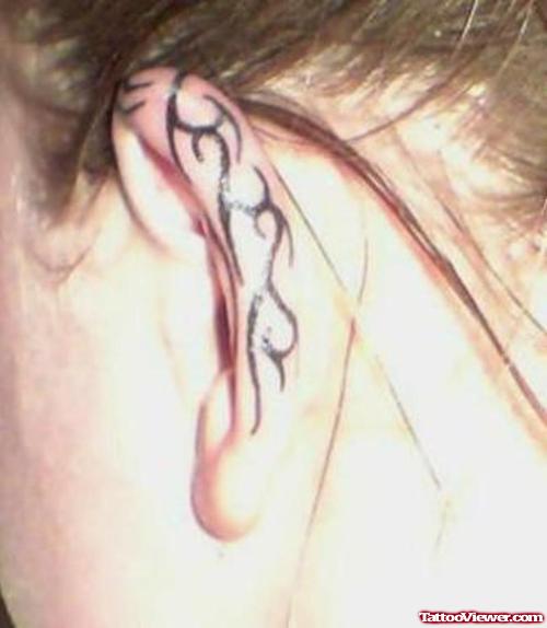 Black Ink Tribal Left Ear Tattoo