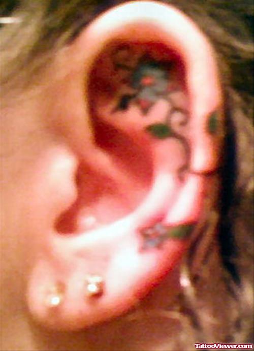 Left Ear Flower Tattoo