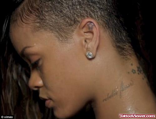 Impressive Rihanna Left Ear Star Tattoo