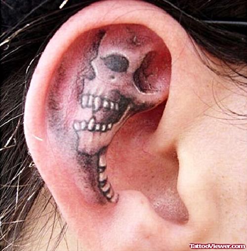 Grey Ink 3D Skull Ear Tattoo