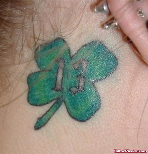 Green Clover Leaf With 13 Number Behind Ear Tattoo