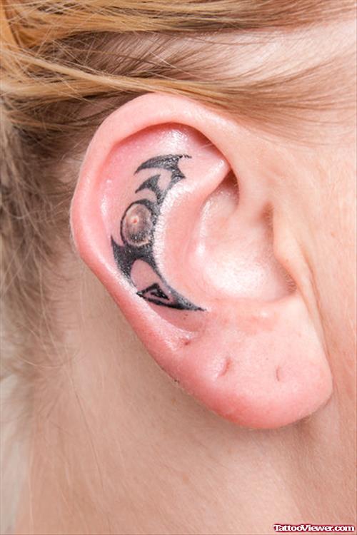 Black Tribal Left Ear Tattoo
