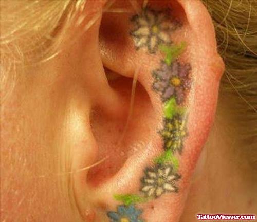 Beautiful Colored Flowers Left Ear Tattoo