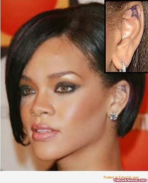 Attractive Rihanna Left Ear Star Tattoo