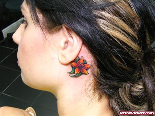 Colored Flower Left Ear Tattoo
