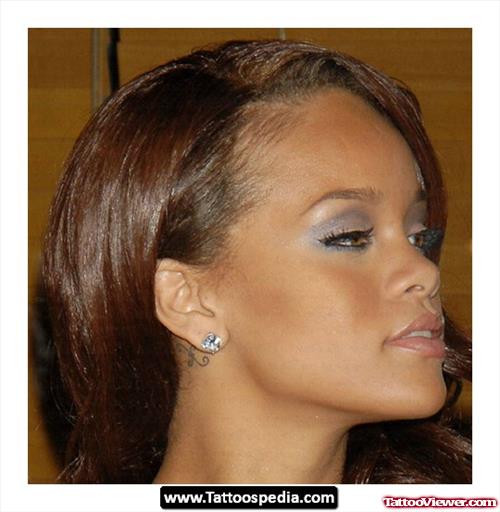 Classic Behind The Ear Tattoo Of Rihanna