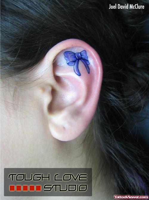 Blue Ink Bow Left Ear Tattoo
