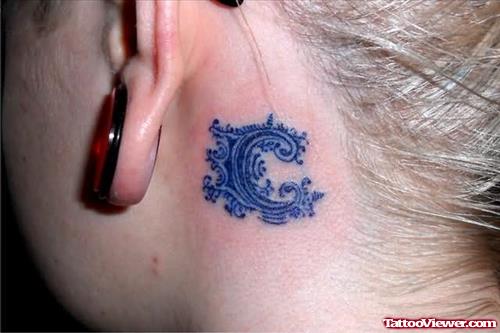Blue Ink Ear Tattoo