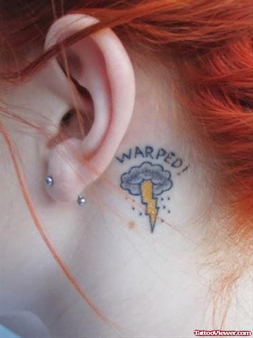 Warped Tattoo On Behind Ear