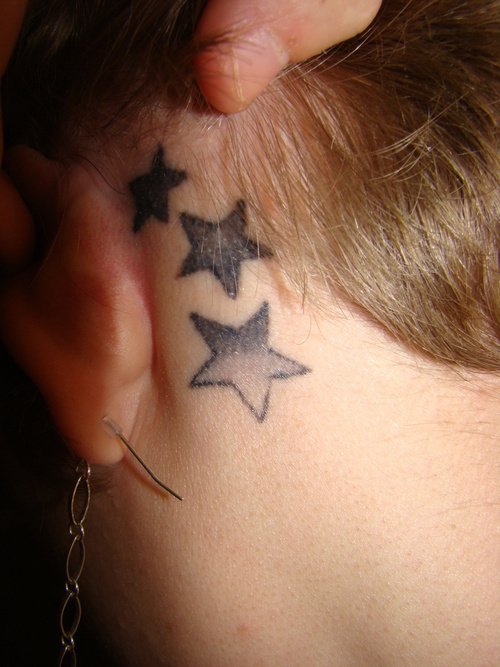 Grey Ink Stars Behind Ear Tattoo
