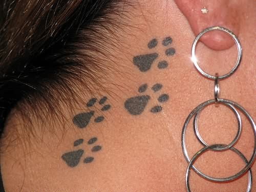 Paw Prints Back Ear Tattoo