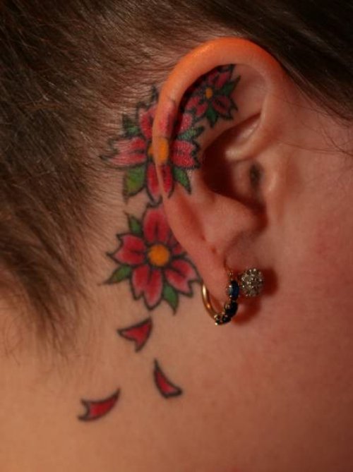 Colour Flower On Ear Tattoo