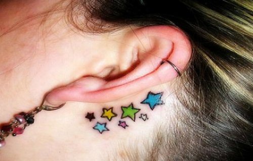 Colored stars Behind Ear Tattoo