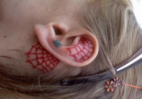 Red Ink Spider Web Ear Tattoo