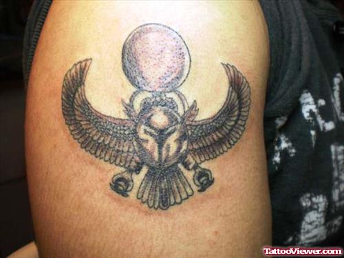 Grey Ink Egyptian Tattoo On Right Shoulder