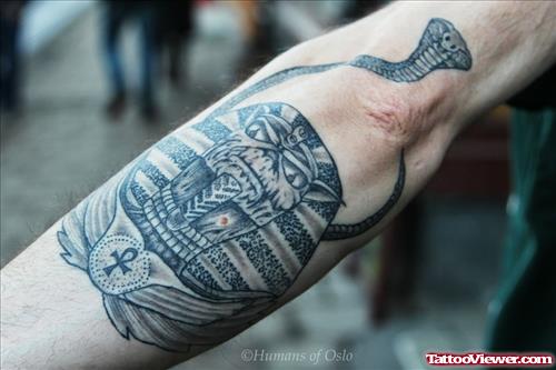 Grey Ink Egyptian Tattoo On Sleeve