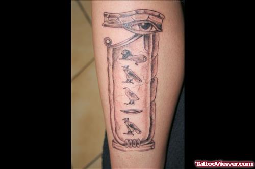 Grey Ink Egyptian Tattoo On Leg
