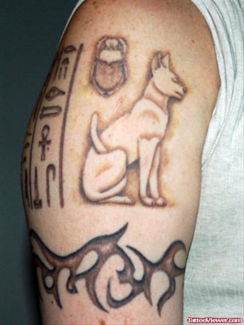 Grey Ink Tribal And Egyptian Tattoo On Half Sleeve