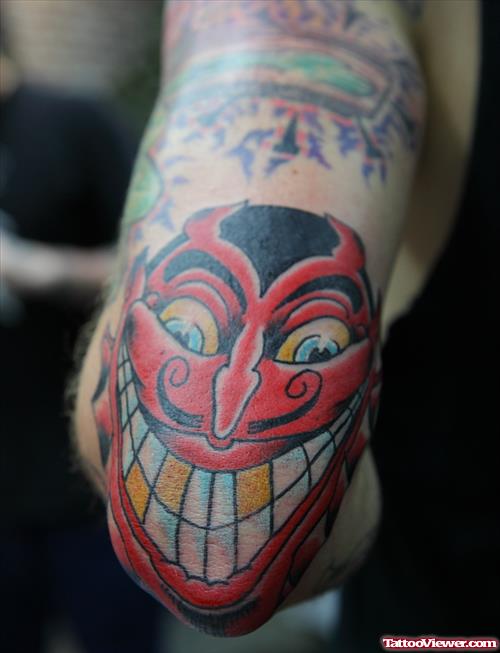 Red Demon Head Elbow Tattoo