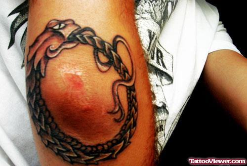 Ouroboros Elbow Tattoo