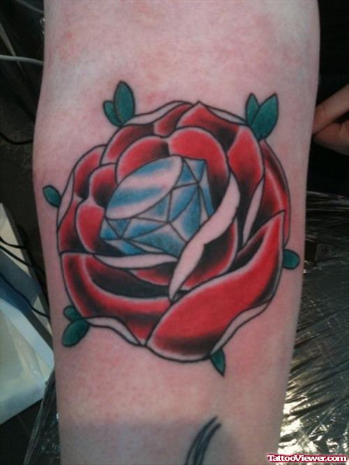 A Blue Diamond And Red Rose Elbow Tattoo