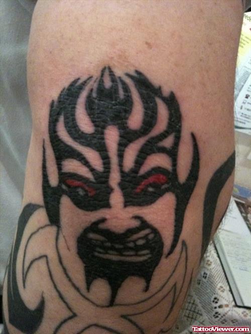 Tribal Demon Head Elbow Tattoo