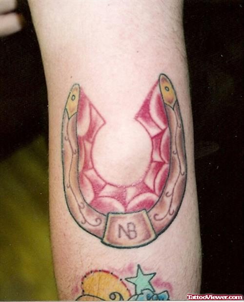 Horseshoe Elbow Tattoo