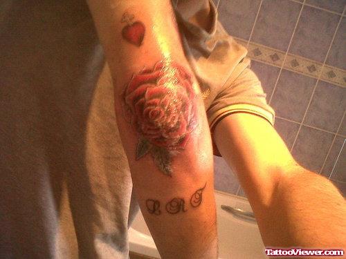 Red Heart And Rose Elbow Tattoo