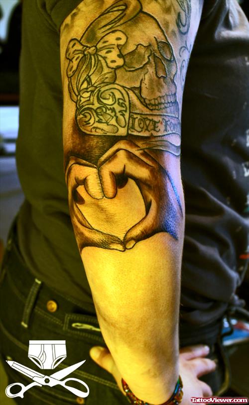 Grey Skull And Hrey Hands Heart Elbow Tattoo