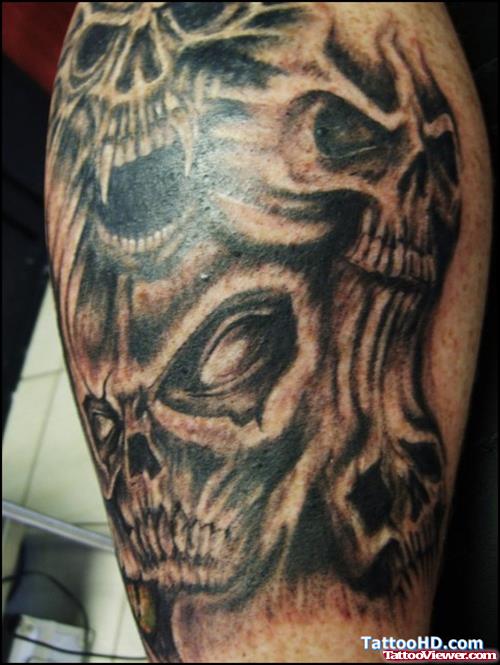 Demon skulls Elbow Tattoo