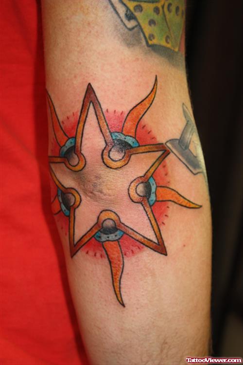Tribal Sun And Star Elbow Tattoo