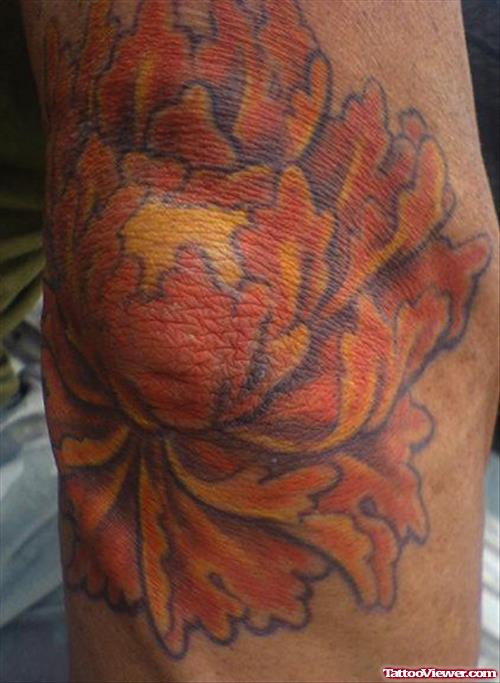 Orange Flower Elbow Tattoo