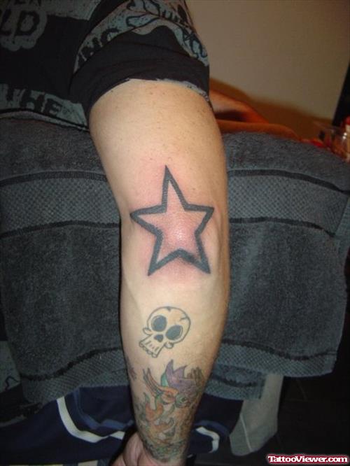 Black Star Elbow Tattoo Design
