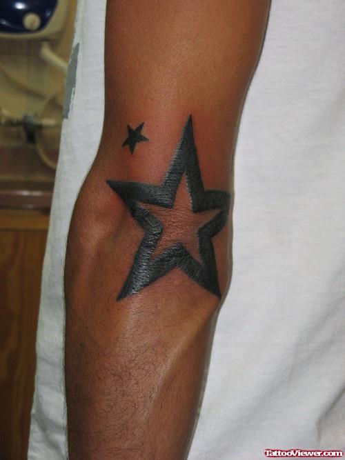 Star Left Elbow Tattoo