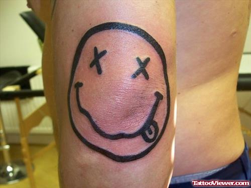 Smiley Elbow Tattoo