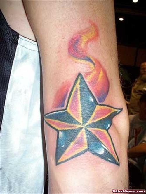 Flaming Nautical Star Elbow Tattoo