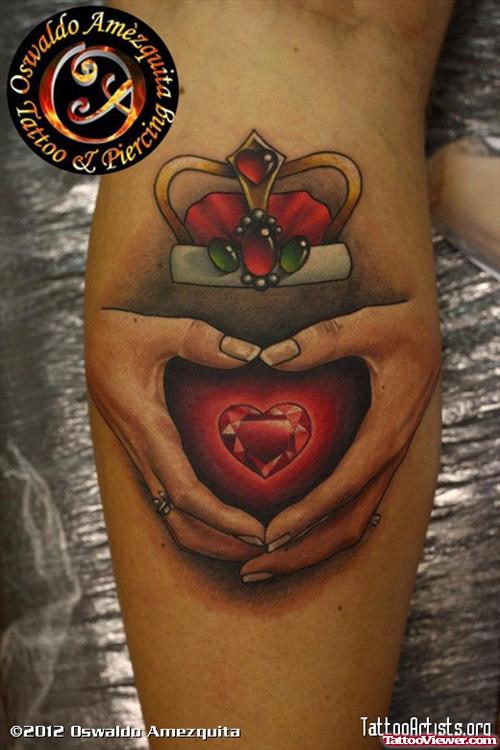 Red Star In Hands And Crown Elbow Tattoo