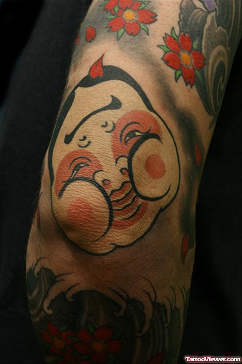 Funny Face Elbow Tattoo