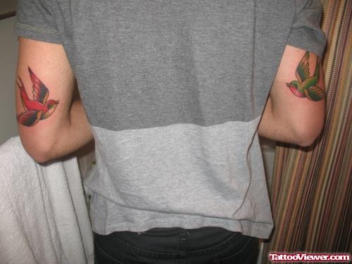 Colored Flying Birds Elbow Tattoos