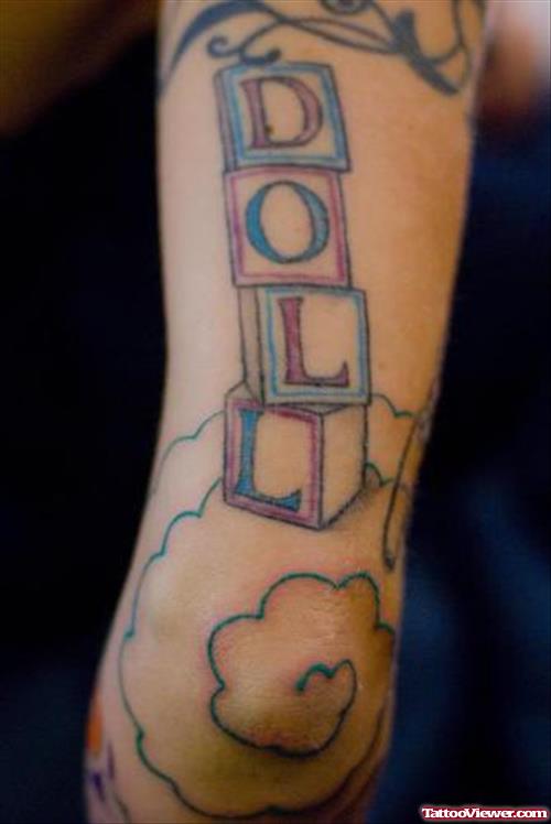 Clouds And Doll Elbow Tattoo
