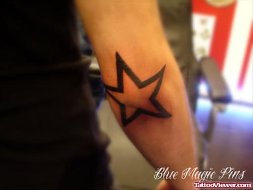Black Outline Star Elbow Tattoo