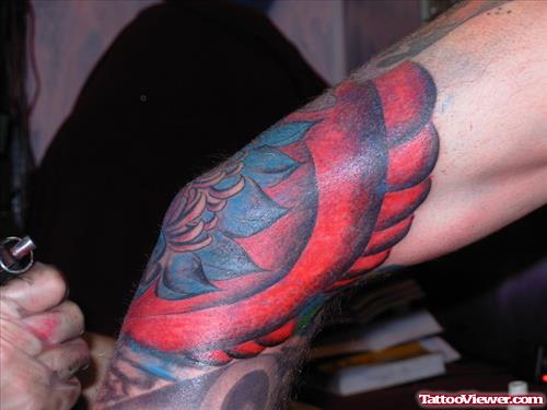 Blue And Red Flower Elbow Tattoo